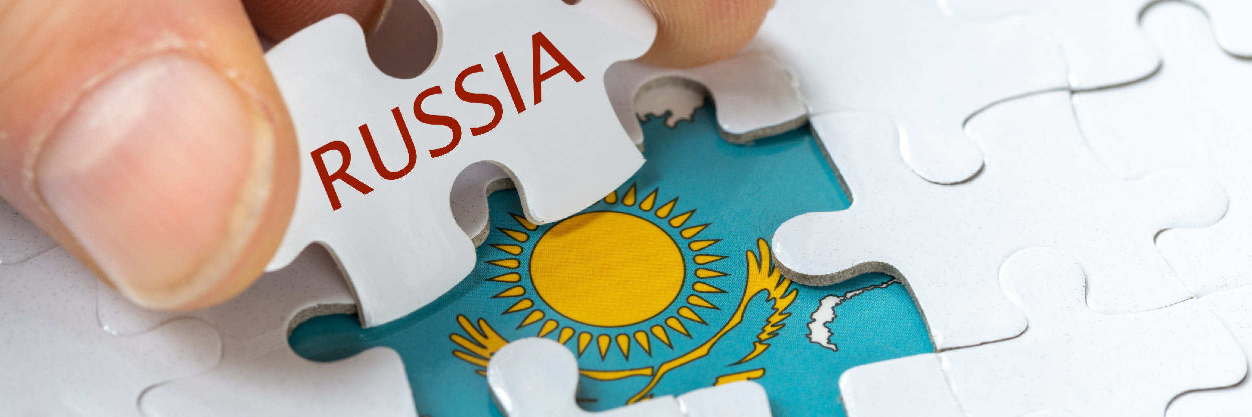 puzzle reveals the flag of Kazakhstan and the inscription Russia, Concept, Mutual relations of both countries